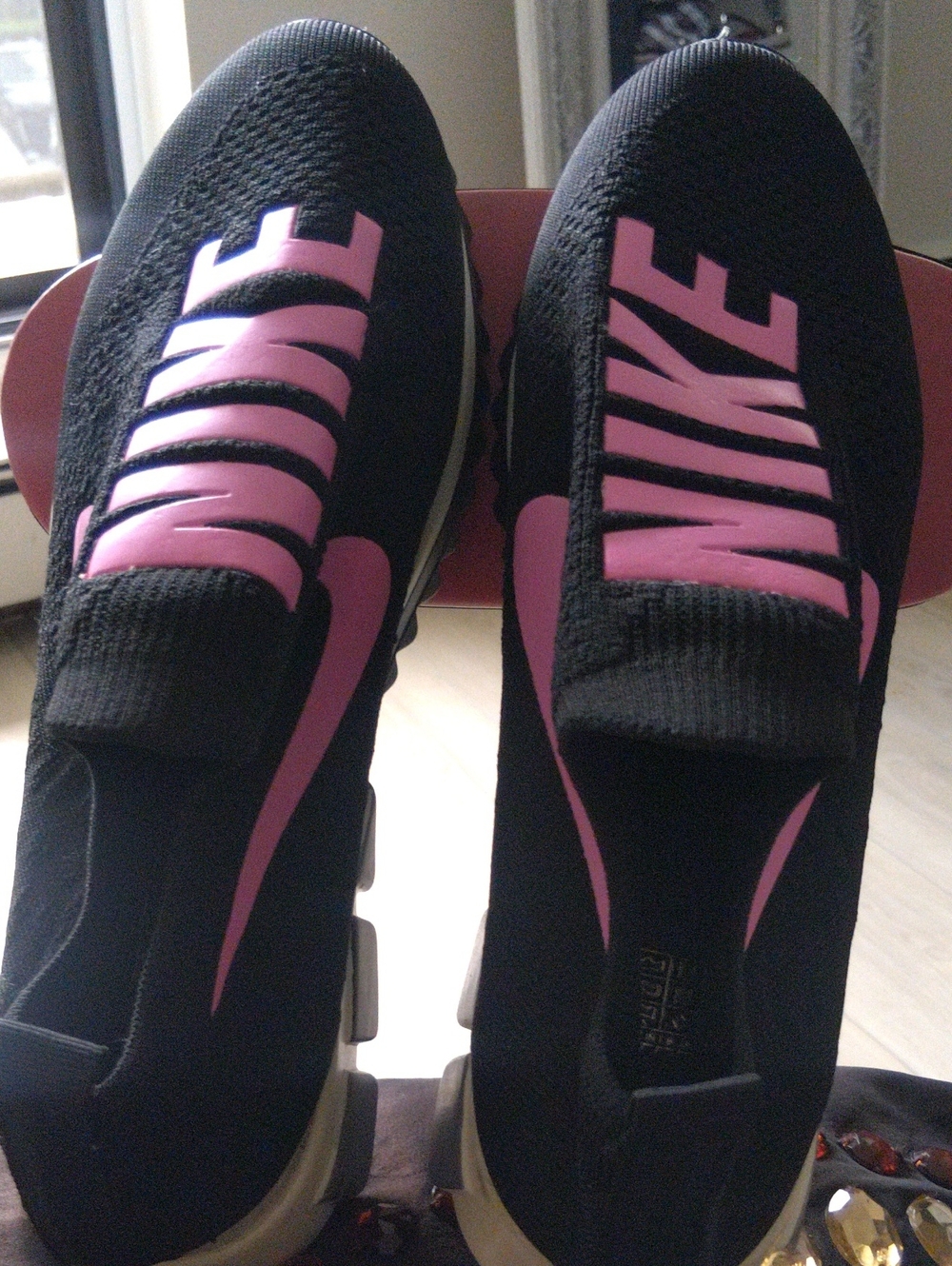 Nike Women’s Black and Pink Slip-On Athletic Sneakers